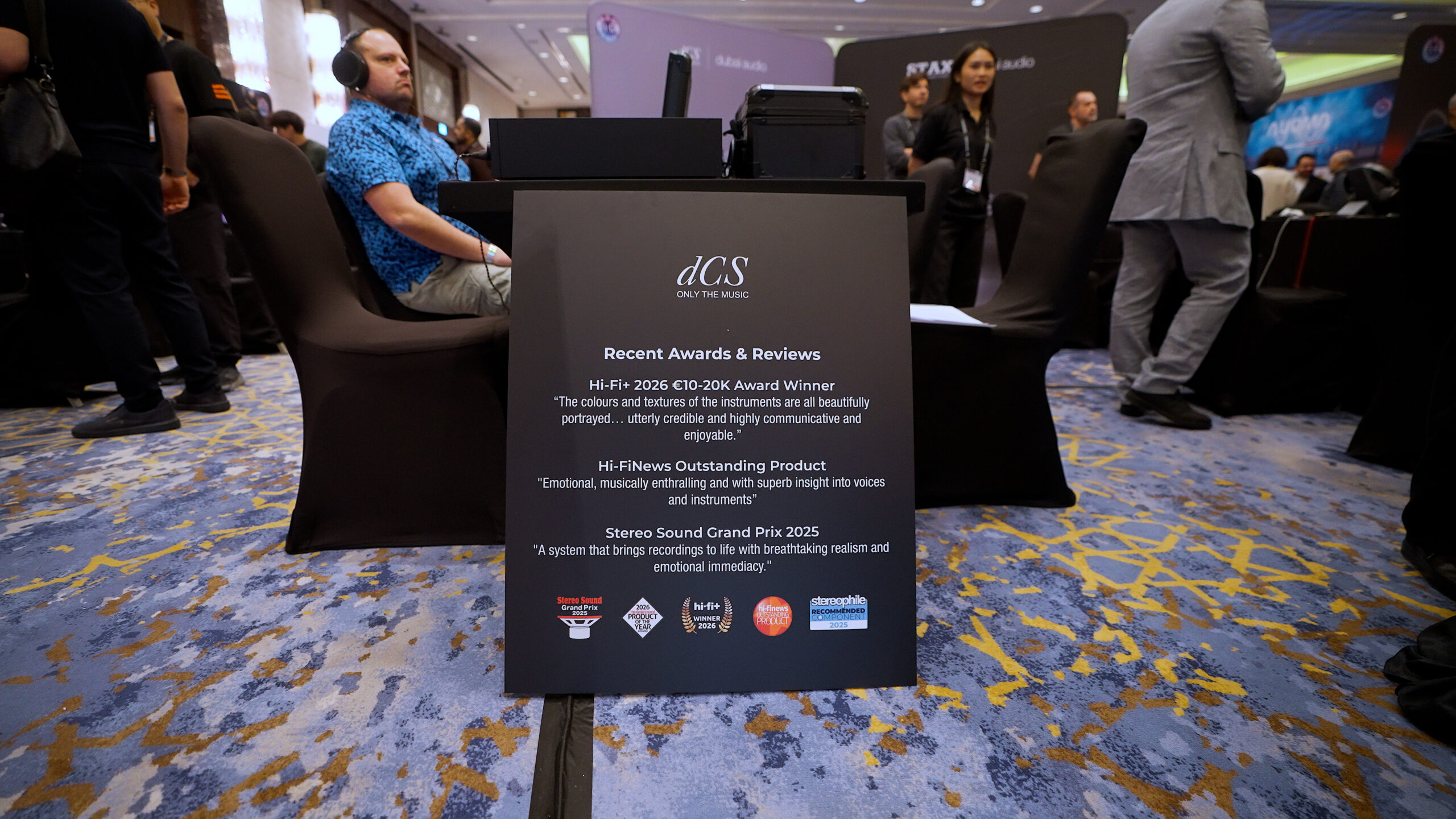  A display plaque at CanJam Dubai 2026 listing recent awards for dCS, including the Hi-Fi Plus 2026 Award and the Stereo Sound Grand Prix 2025.