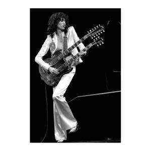 Jimmy Page of Led Zeppelin playing the guitar in 1977