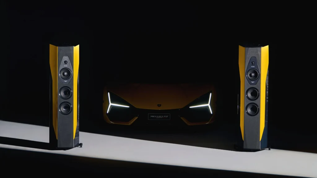Sonus faber Il Cremonese Ex3me Automobili Lamborghini Edition luxury speaker displayed beside a Lamborghini super sports car.